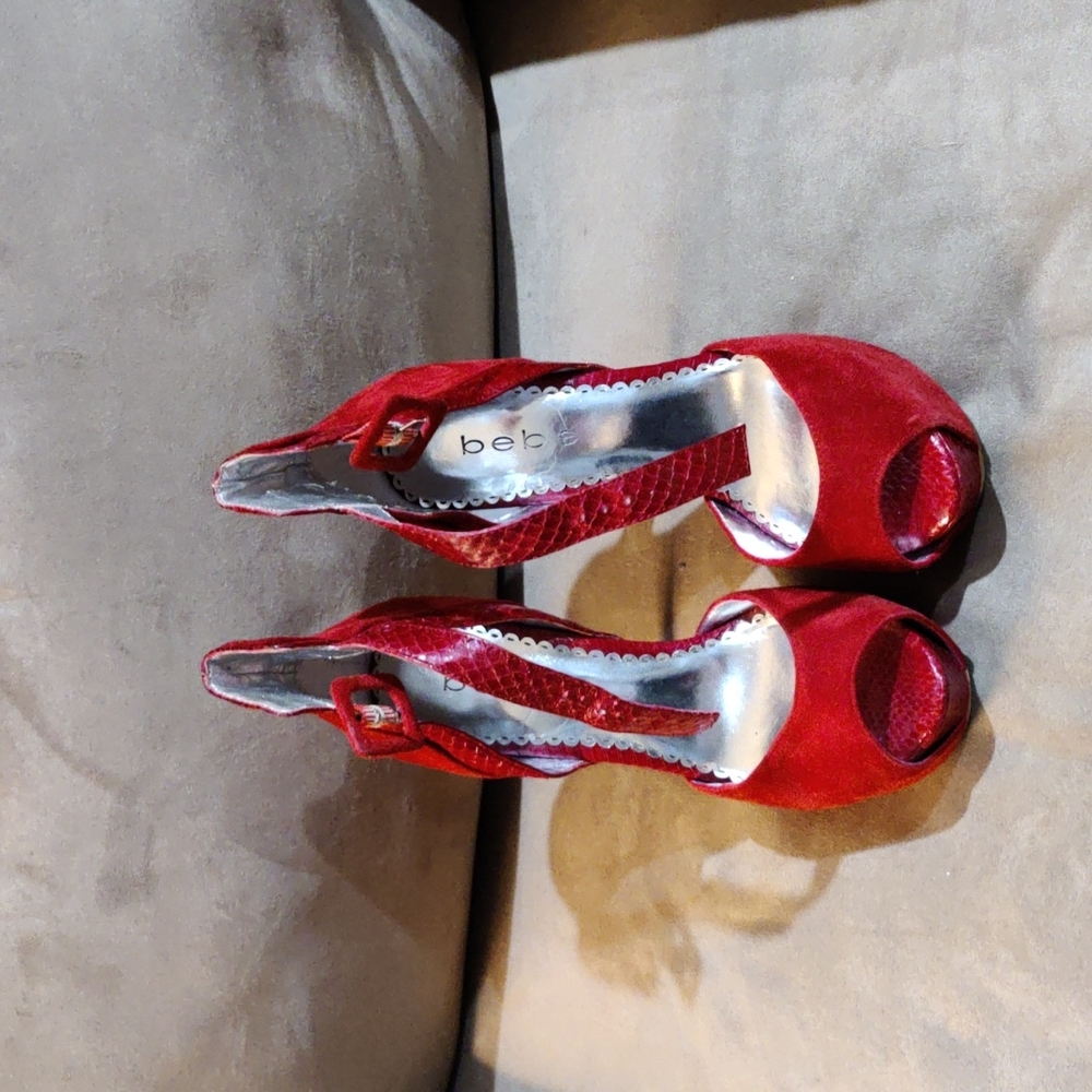 Bebe high suede and skin strap high heels.